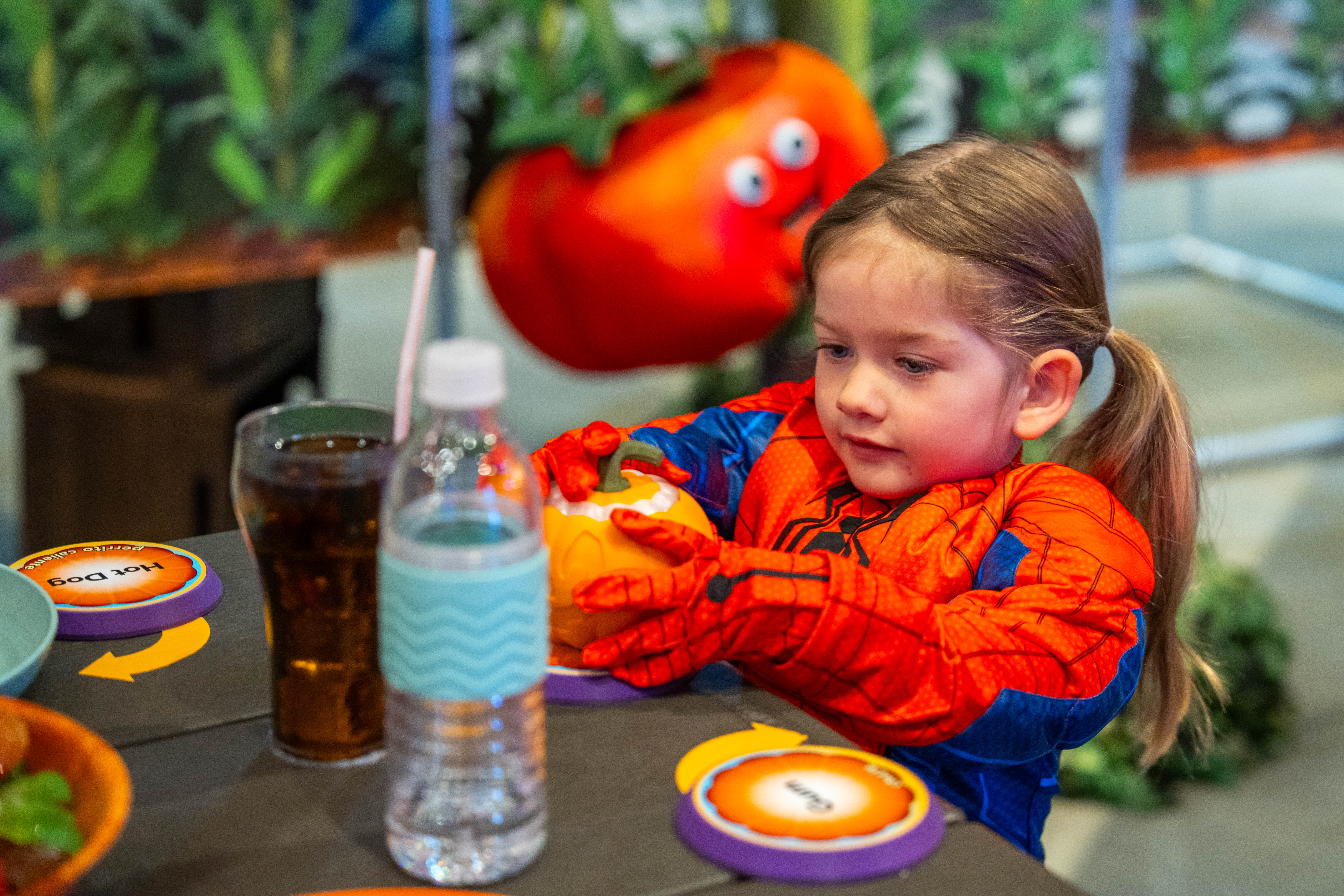 child with pumpkin
