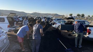 Orange County residents scooping compost