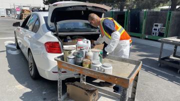 Staff collecting paint at our household hazardous waste collection center