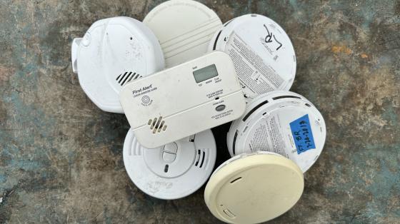 Photo of a collection of smoke and carbon monoxide detectors.