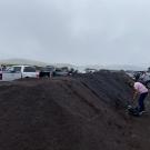 Resident shoveling compost