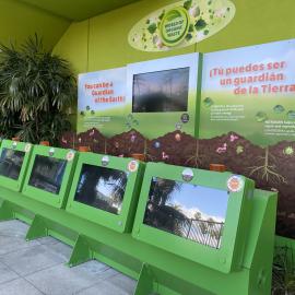 World of Organic Waste game at Discovery Cube. Five green monitors with TV learning display.