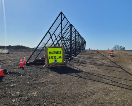 green OCWR mattress recycling sign in front of wind screens