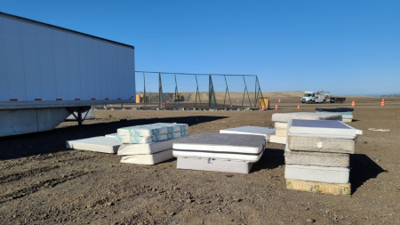 Mattresses stacked, being prepared to be recycled
