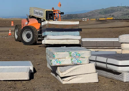 Mattresses stacked being prepared to be recycled