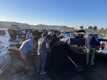 Orange County residents scooping compost