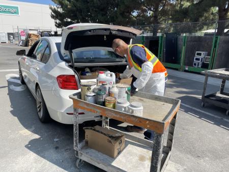 Staff collecting paint at our household hazardous waste collection center